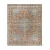 “Vintage Tabriz rug with medallion design in rust and blue tones, hand-knotted in Iran”