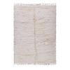 Soft ivory Berber rug handwoven from Atlas wool with thick pile and minimal design