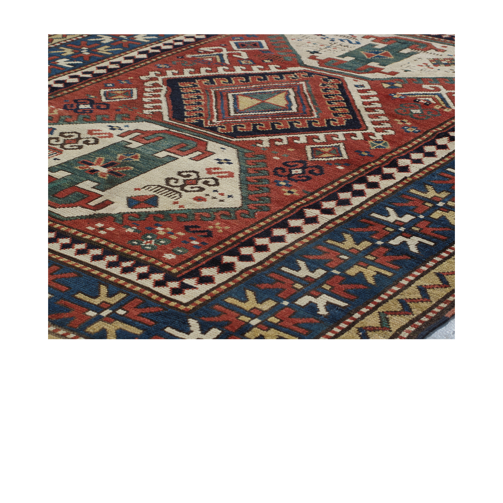This Kazak rug is hand-knotted and made of 100% wool.