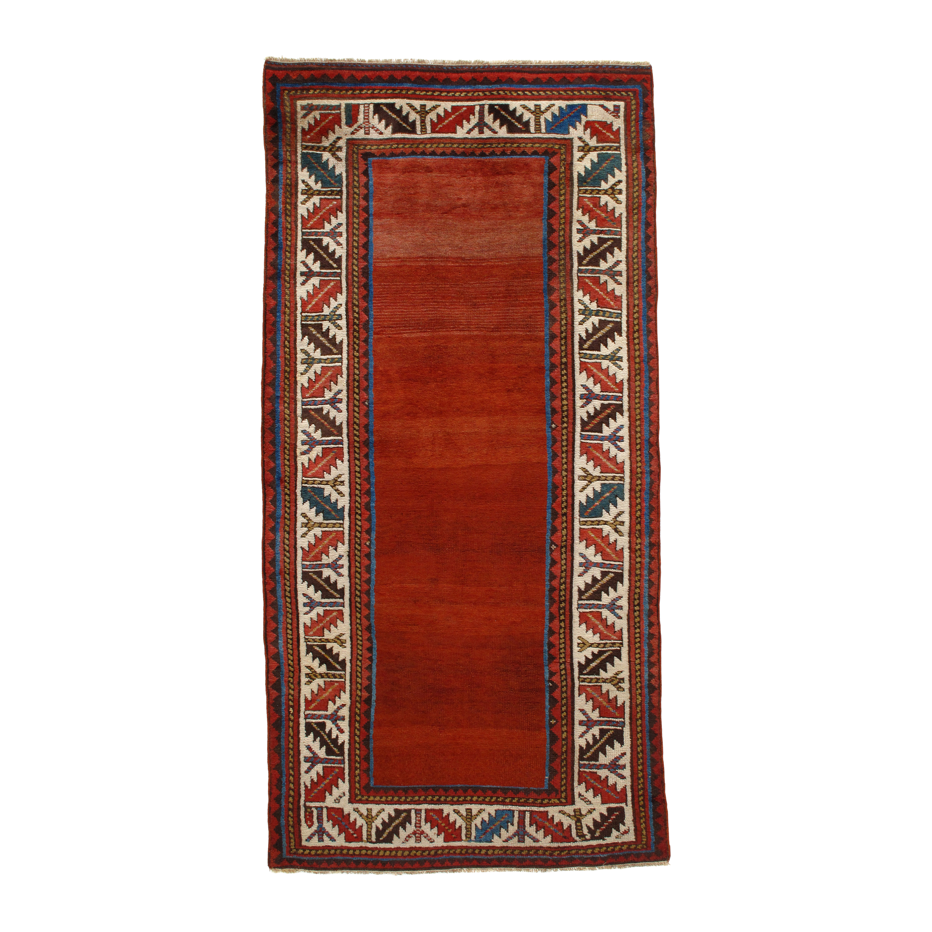 This Kurdish rug  is crafted using hand-carded Persian wool and natural dyes.