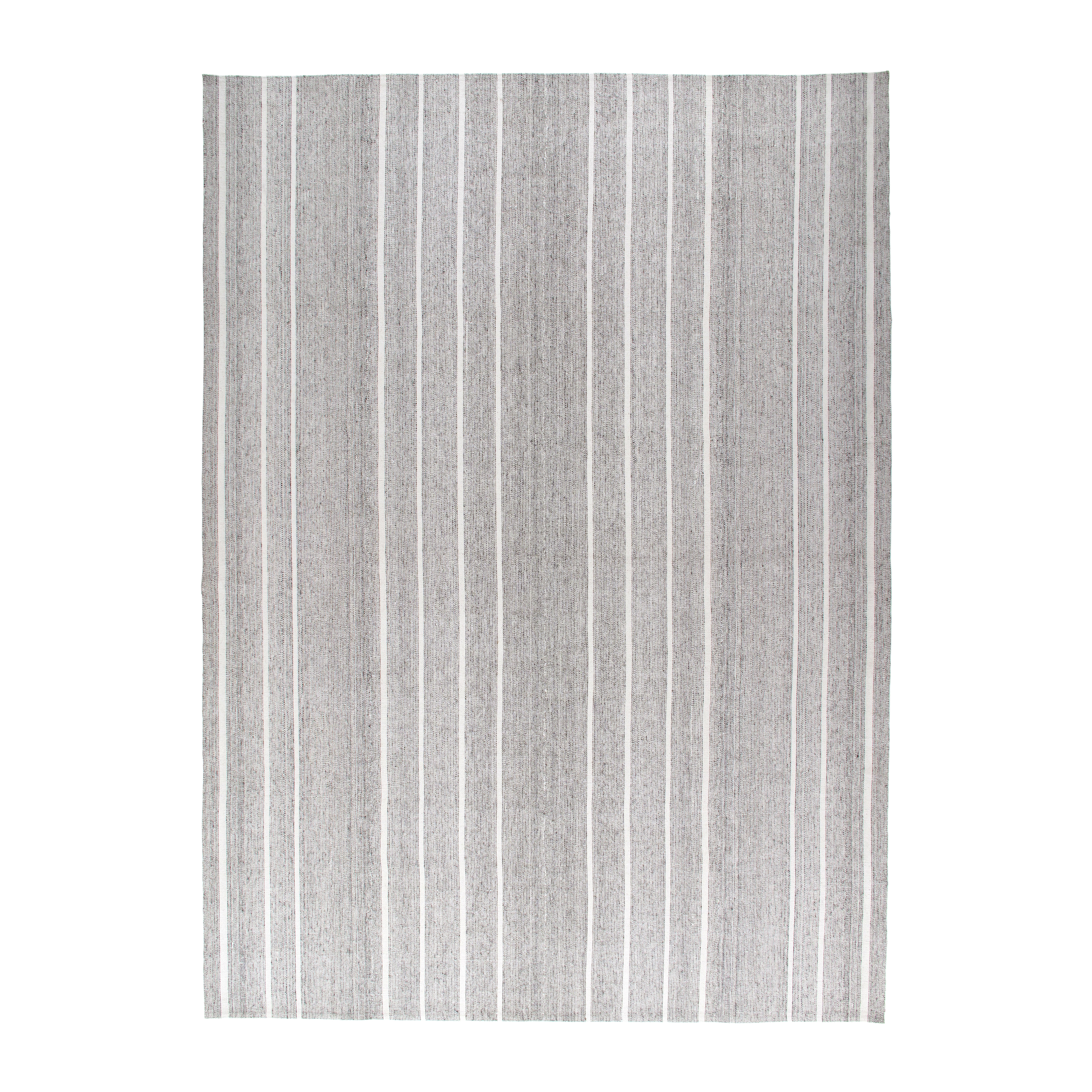 This Pelas rug flatweave rug is made with handspun wool and cotton and natural dyes. 