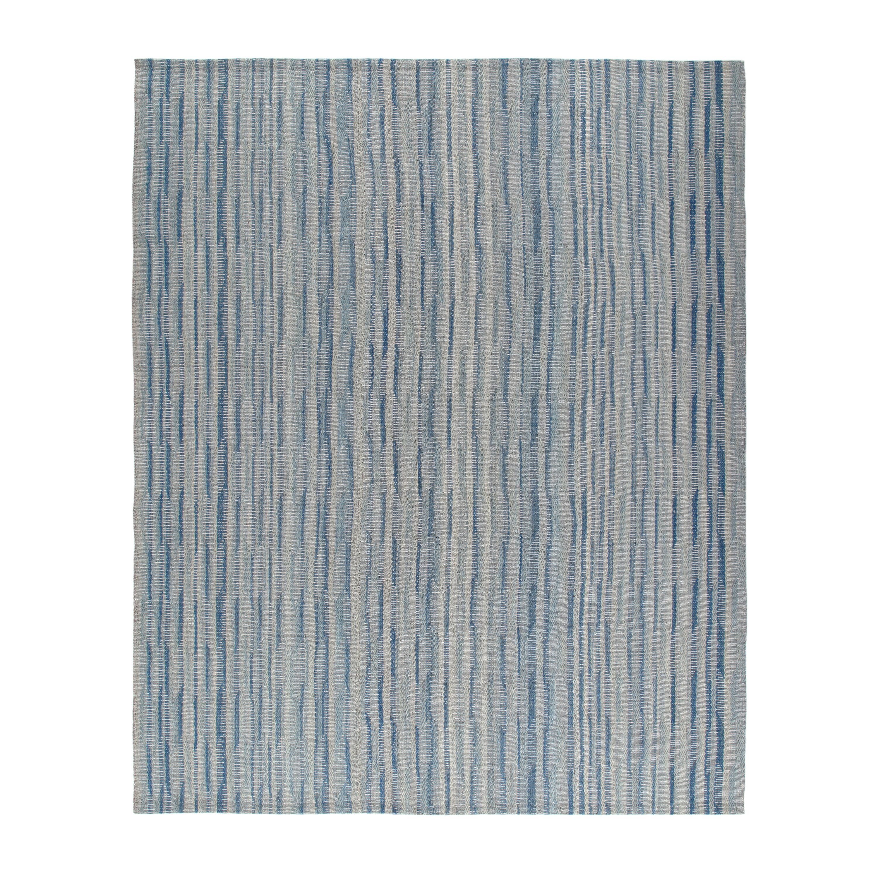 This Pelas Douro flatweave rug is made with handspun wool and natural dyes.