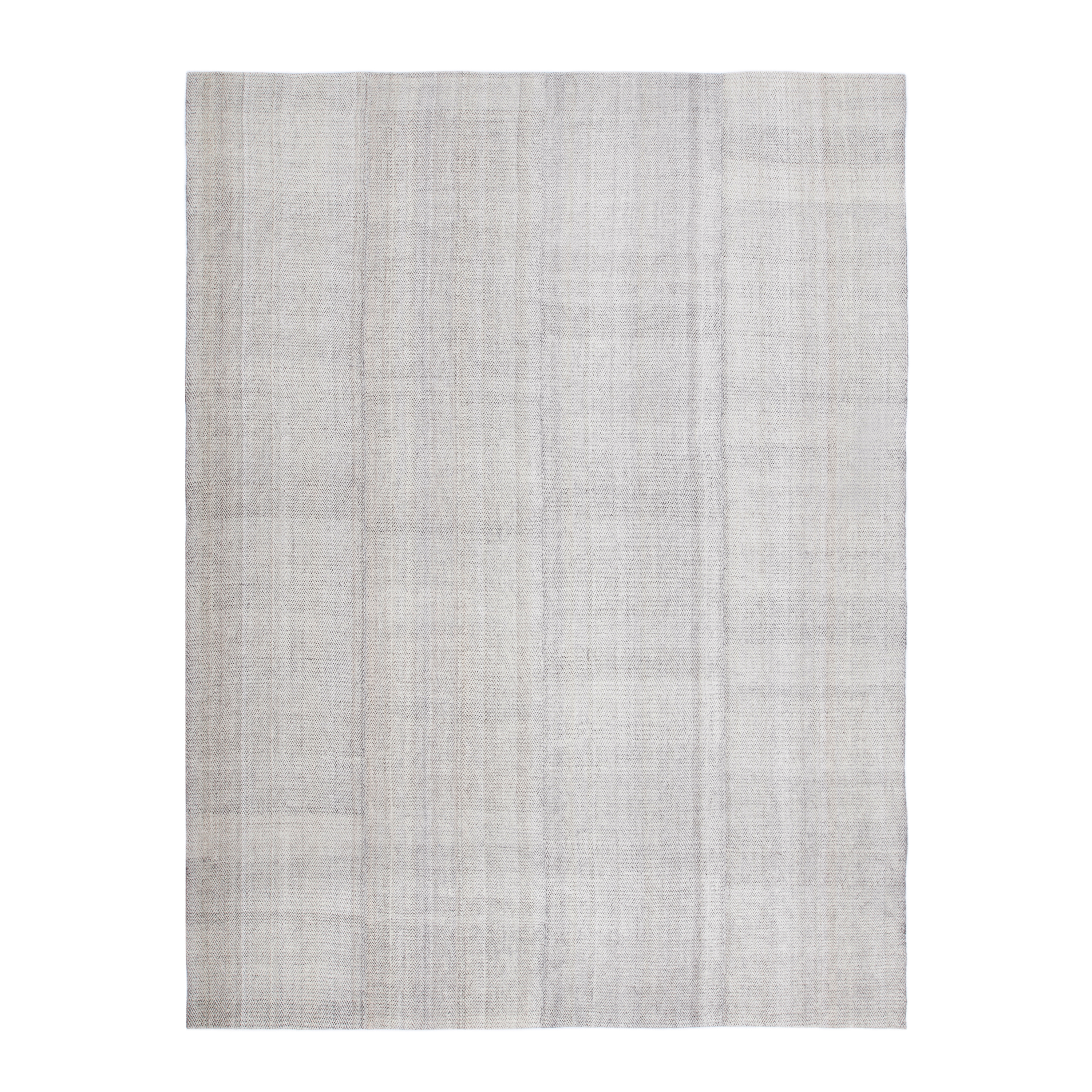 This Pelas Charmo flatweave rug is made with handspun wool and natural dyes.