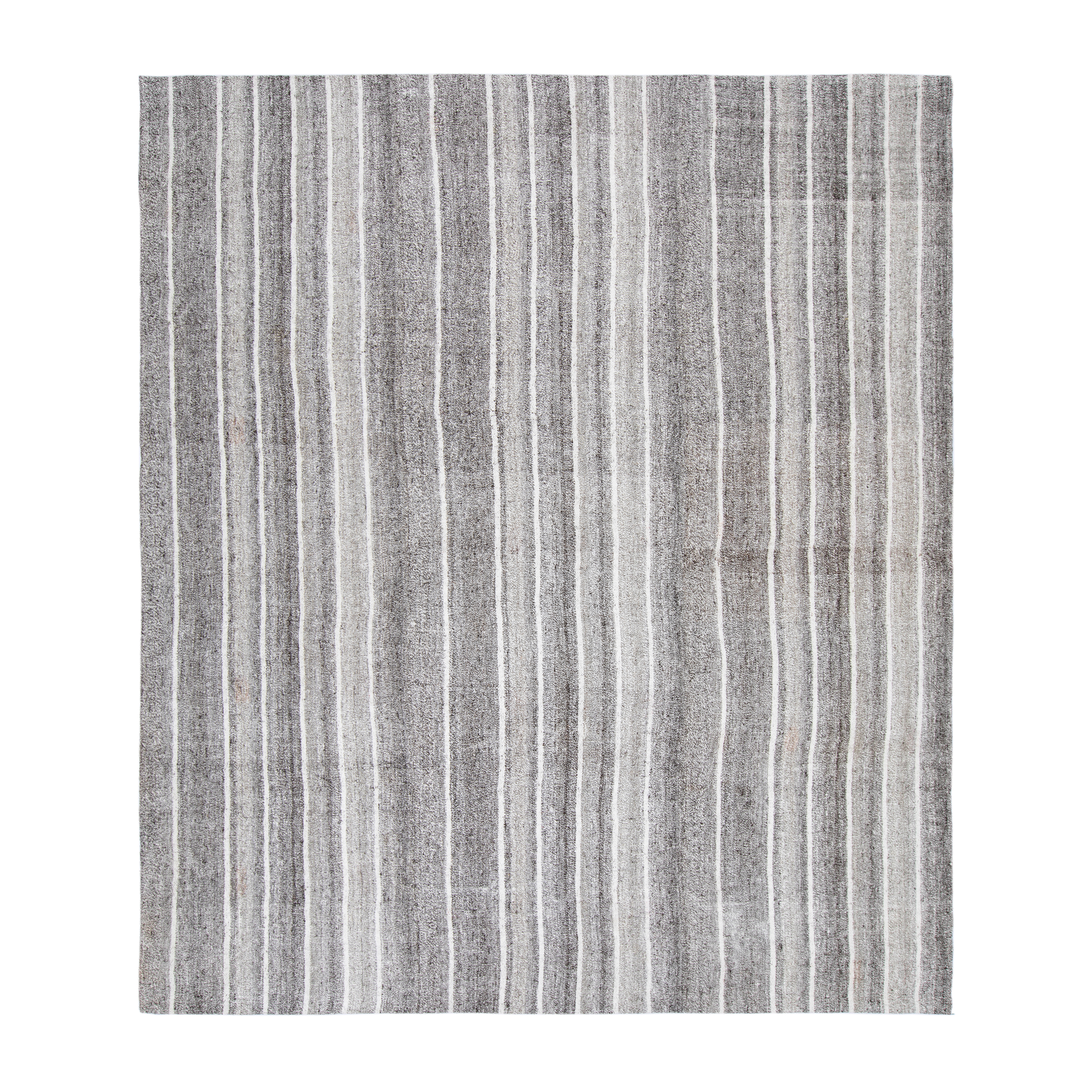 This Stripe Rug is hand-woven and made of wool.