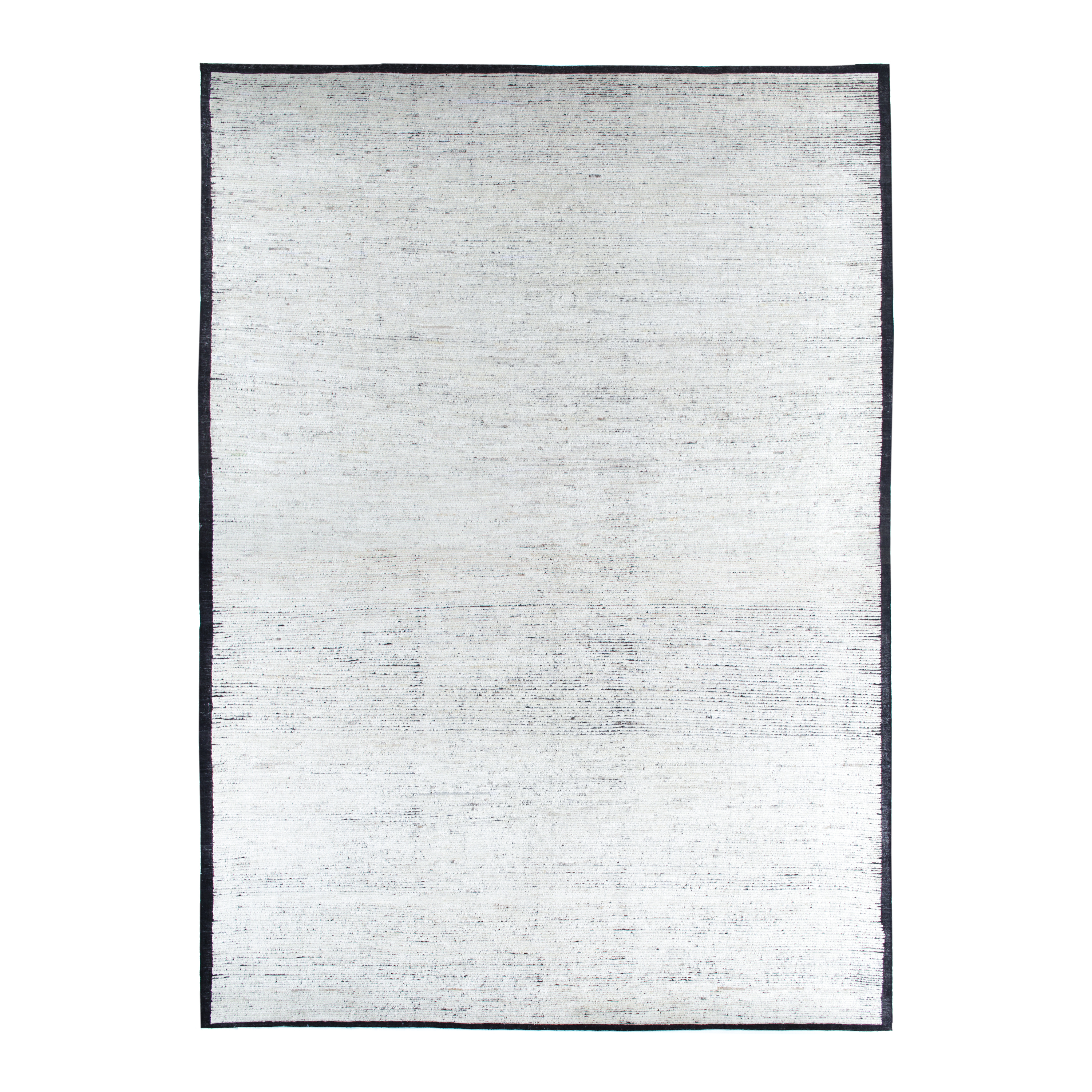 African rug is hand-knotted from naturally dyed wool with subtle silk accents. 