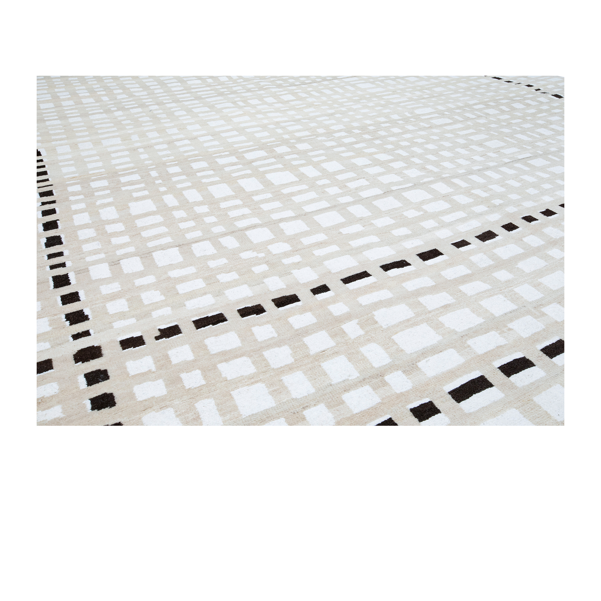 Morno rug is a hand-knotted modern piece made from naturally dyed wool and cotton accents. 