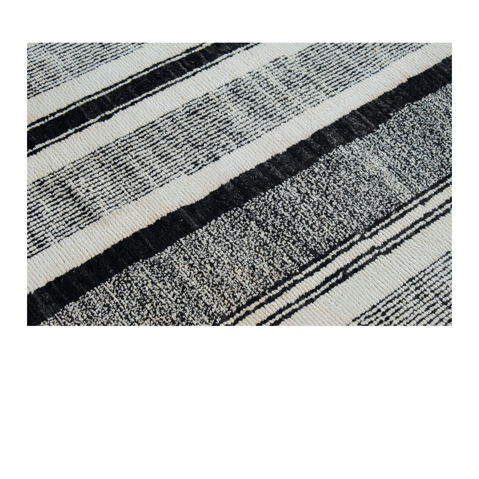 Hand-knotted black and white and modern rug.