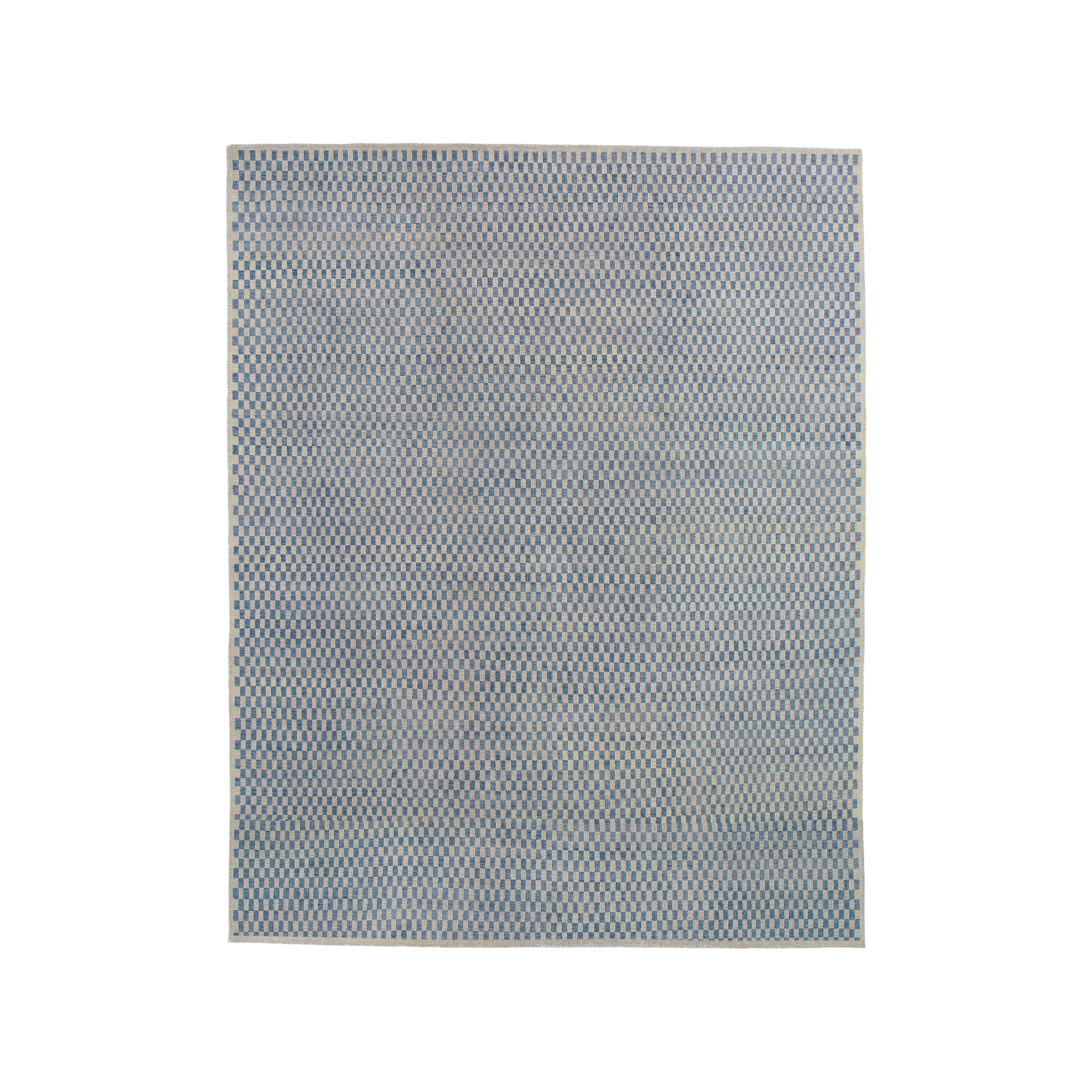 This Checkered flatweave rug this hand-knotted and made from the finest handspun undyed wool. 