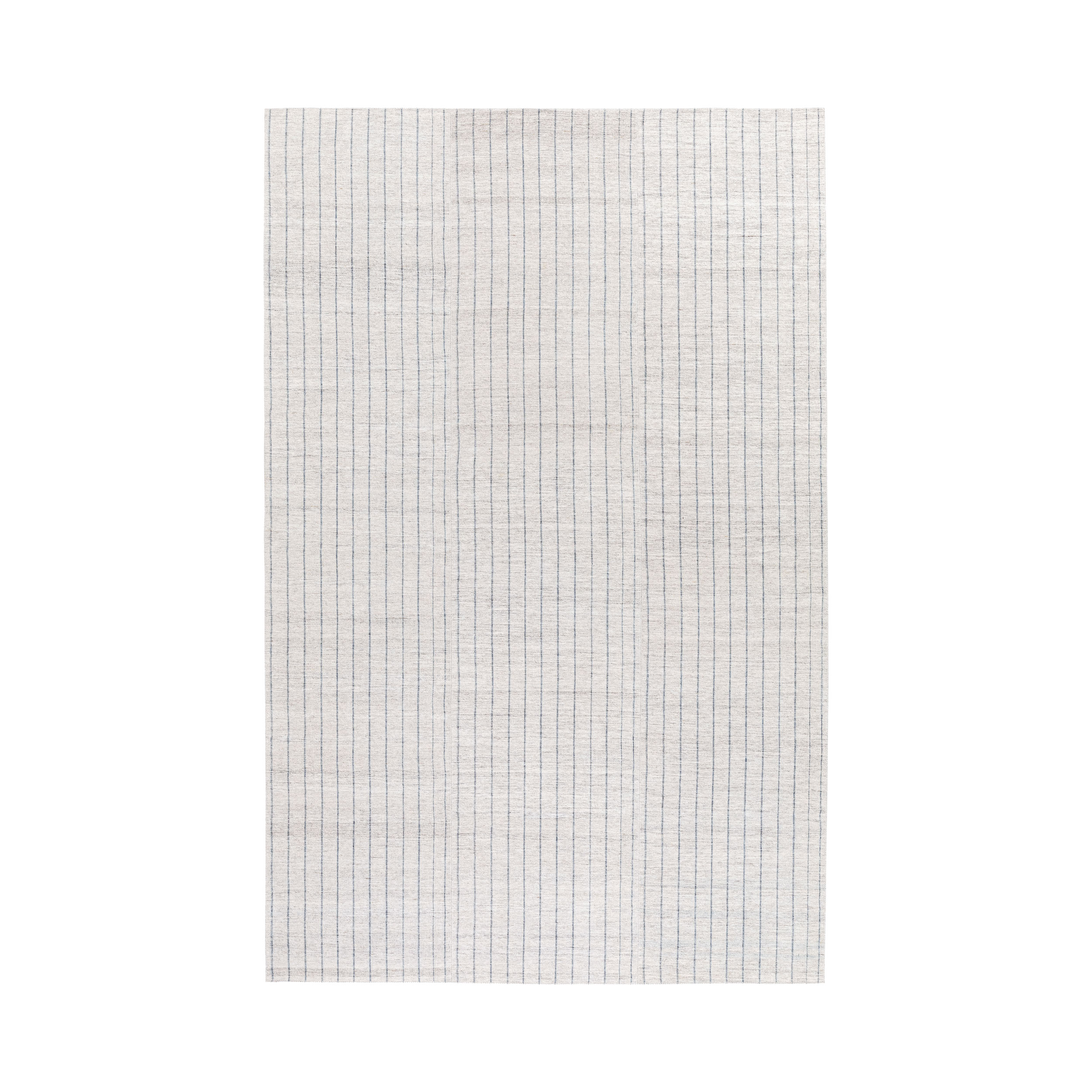 Pelas flatweave rug with a striped design that is made with handspun wool and natural dyes