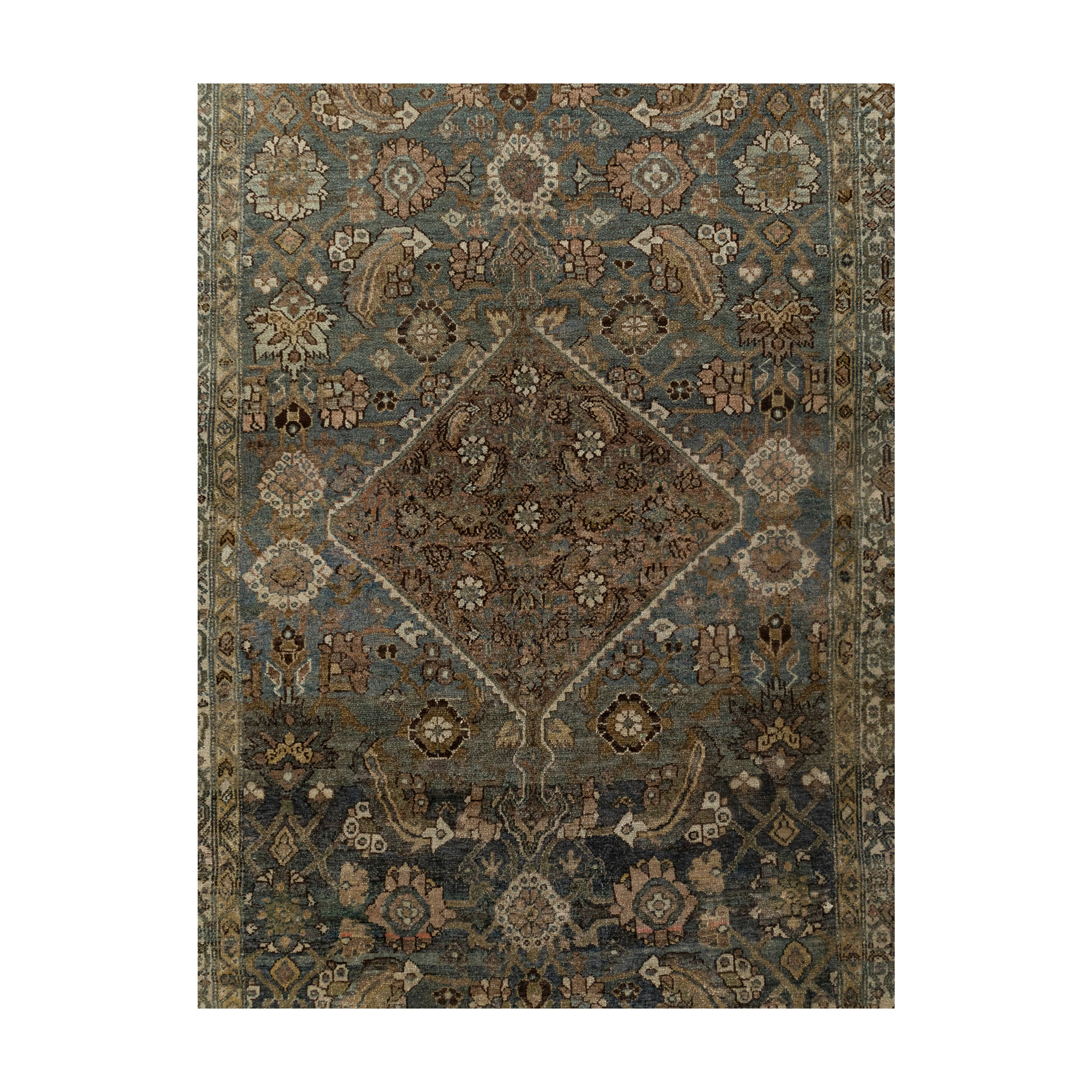 Antique Persian Hamadan rug with medallion and floral motifs in indigo and earth tones – Nasiri Carpets