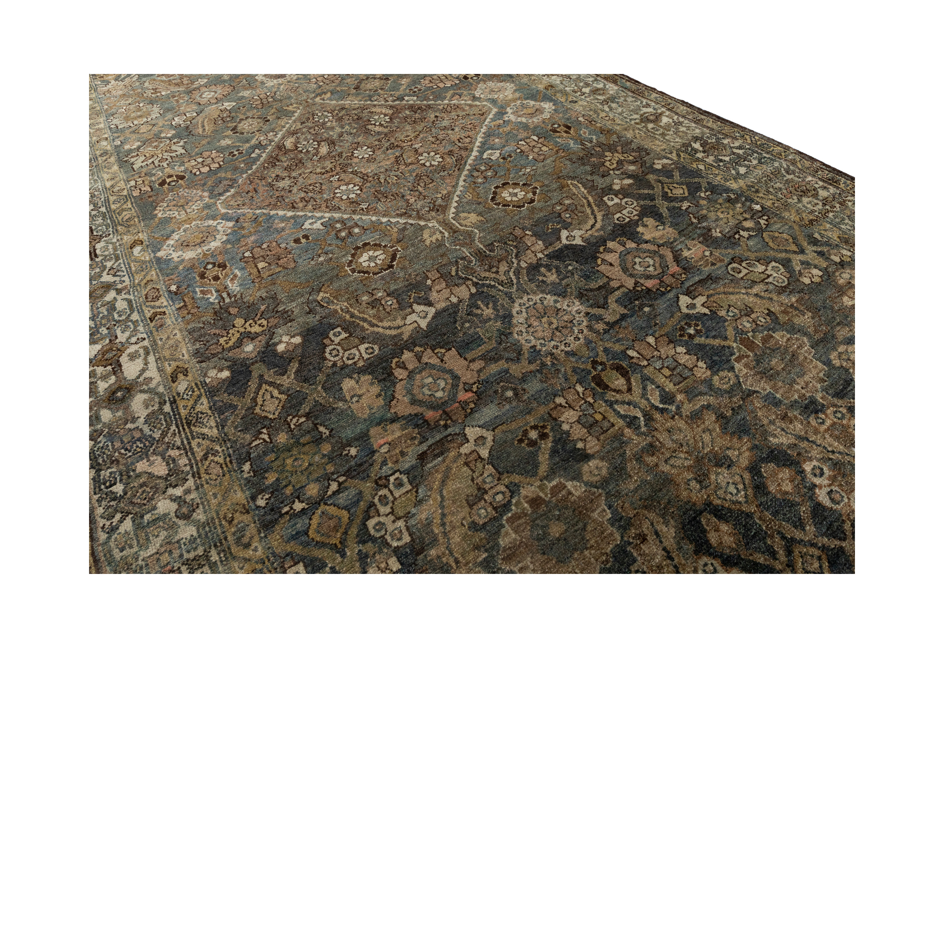 Antique Persian Hamadan rug with medallion and floral motifs in indigo and earth tones – Nasiri Carpets