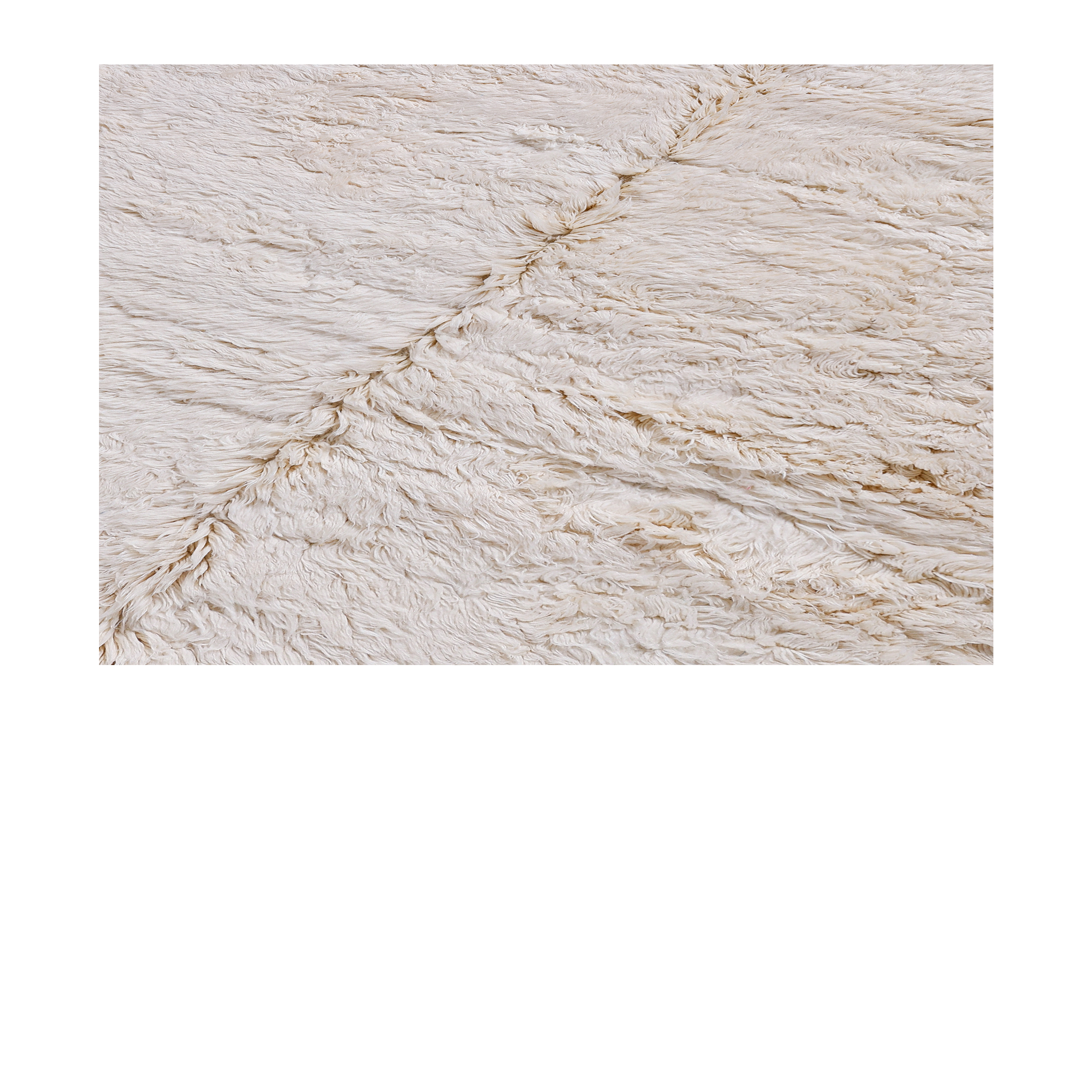 Soft ivory Berber rug handwoven from Atlas wool with thick pile and minimal design