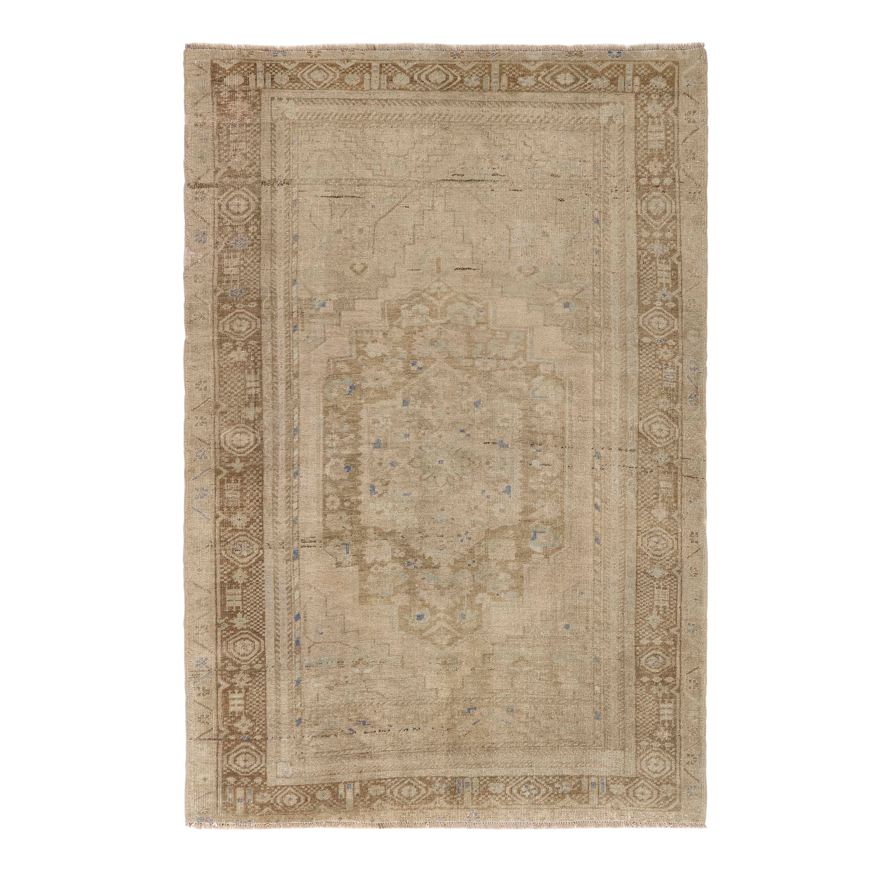 Natural Anatolian vintage rug with soft beige tones and faded medallion design, handwoven wool rug from Turkey by nasiricarpets