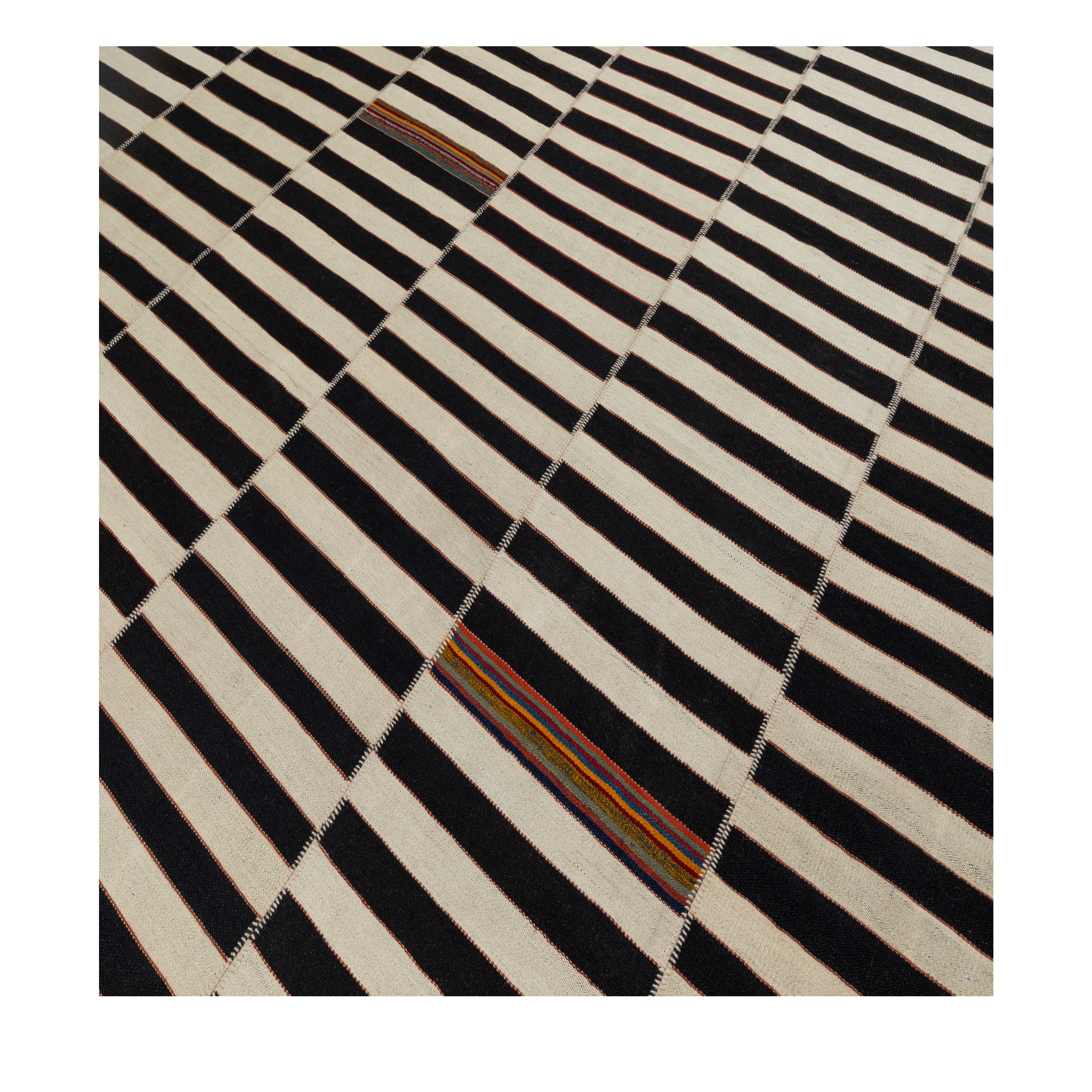 Mazandaran Noir custom hand woven flatweave in black and ivory stripes with subtle terracotta and indigo accents by Nasiricarpets